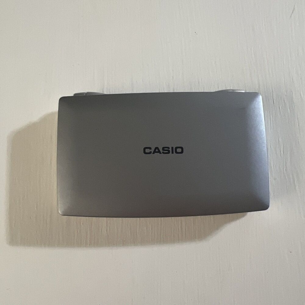Casio Dual Leaf SL-100L Mini Pocket Calculator Tested Working Solar Charge Power